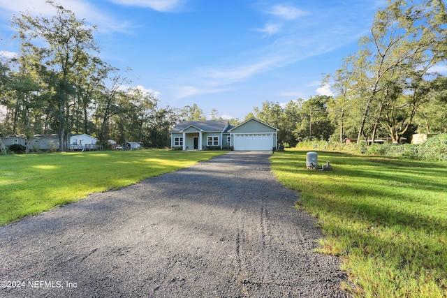 5231 Peggy Ln, Middleburg, FL 32068 - view of front of house with driveway and a front yard