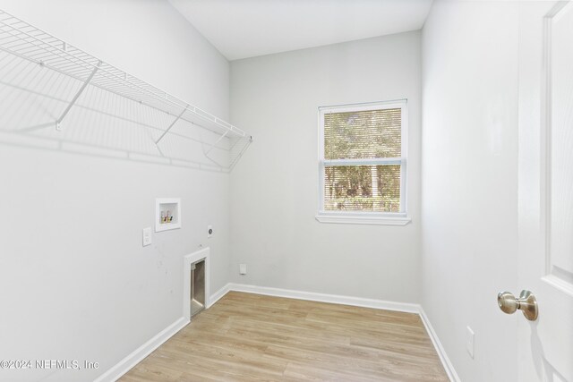 5231 Peggy Ln, Middleburg, FL 32068 - laundry room featuring light wood-style floors, washer hookup, electric dryer hookup, and laundry area