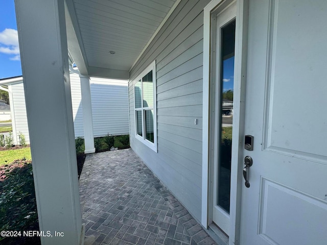 doorway to property featuring a porch