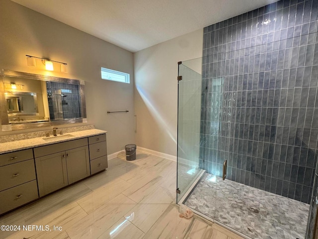 bathroom featuring vanity and a shower with shower door