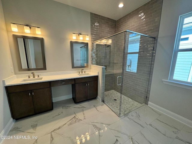 bathroom with vanity and a shower with shower door