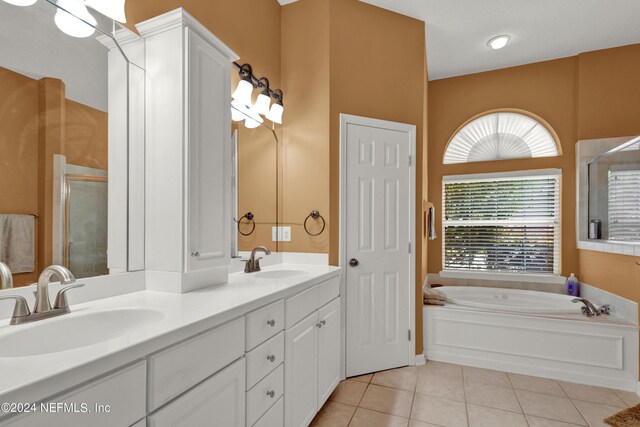 bathroom with vanity, independent shower and bath, and tile patterned flooring