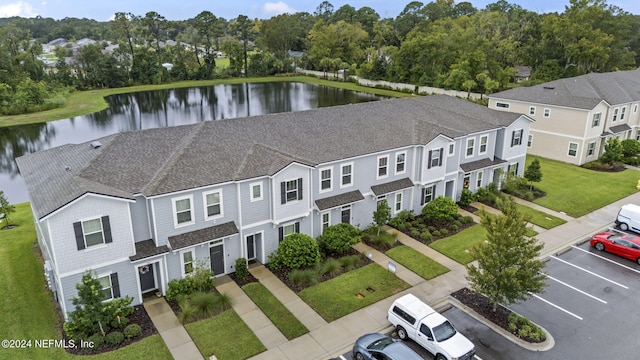 birds eye view of property featuring a water view