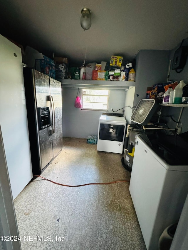 kitchen with washer / clothes dryer, stainless steel fridge, and white fridge