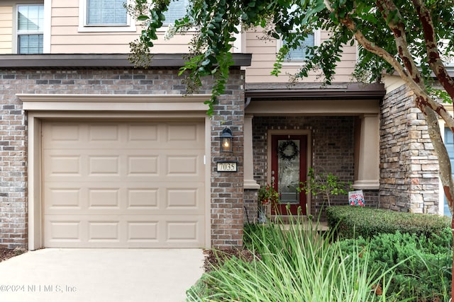 entrance to property featuring a garage