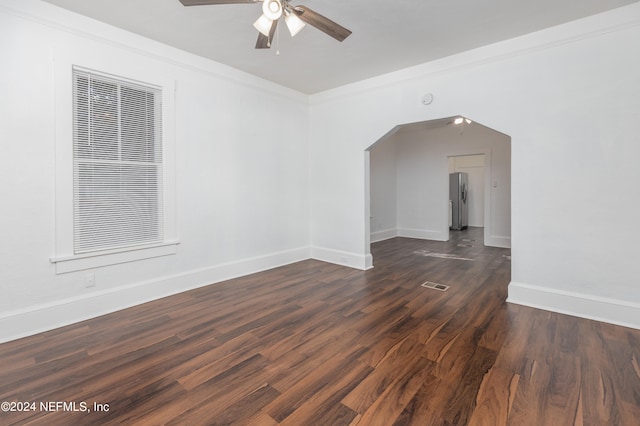 unfurnished room featuring ornamental molding, dark hardwood / wood-style flooring, and ceiling fan