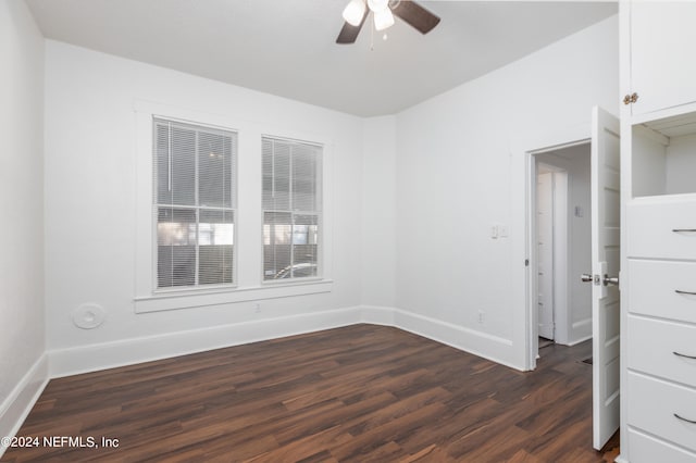 unfurnished room with ceiling fan and dark hardwood / wood-style floors