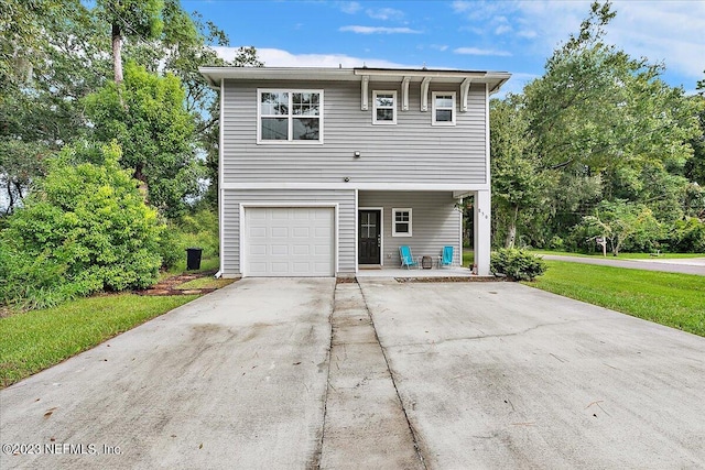 view of front of property with a garage