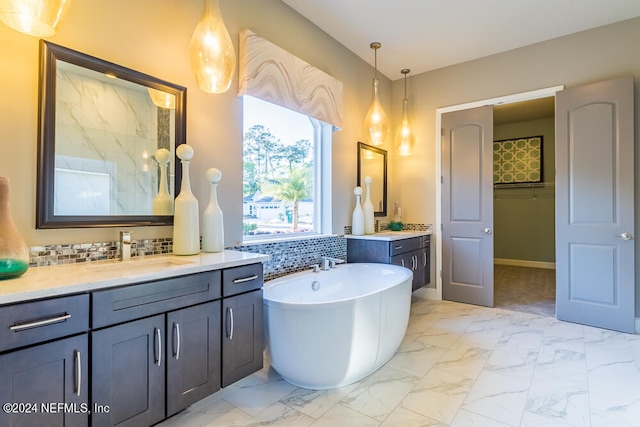 bathroom featuring vanity, decorative backsplash, and a washtub