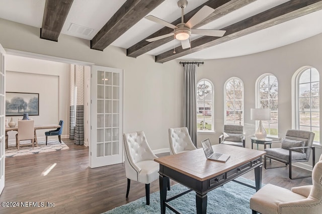 interior space with ceiling fan, dark hardwood / wood-style floors, and beam ceiling