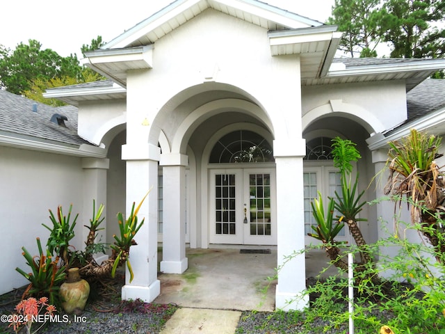 view of exterior entry featuring french doors