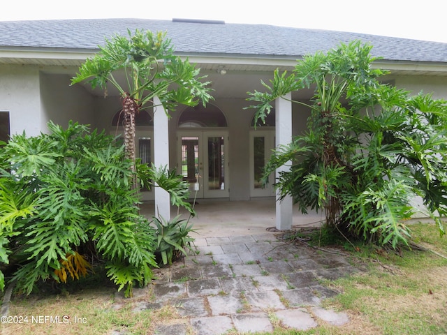 exterior space with french doors and a patio area