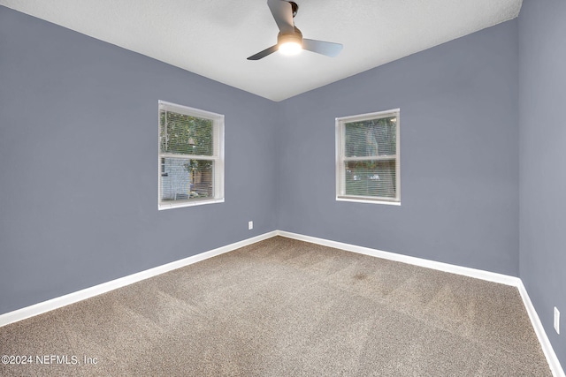 2916 Lippia Rd, Jacksonville, FL 32209 - carpeted empty room featuring baseboards and a ceiling fan