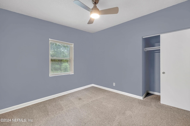 2916 Lippia Rd, Jacksonville, FL 32209 - unfurnished bedroom with baseboards, a closet, ceiling fan, and carpet