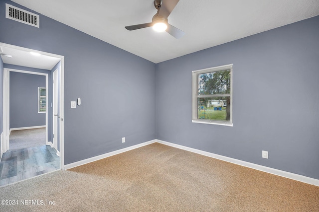 2916 Lippia Rd, Jacksonville, FL 32209 - spare room featuring baseboards, visible vents, a healthy amount of sunlight, and a ceiling fan