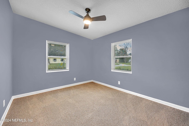 2916 Lippia Rd, Jacksonville, FL 32209 - carpeted empty room with baseboards, a textured ceiling, and a ceiling fan
