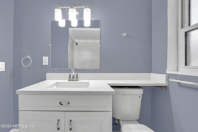 2916 Lippia Rd, Jacksonville, FL 32209 - bathroom featuring toilet, vanity, and walk in shower