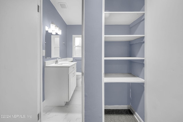 2916 Lippia Rd, Jacksonville, FL 32209 - bathroom featuring visible vents, baseboards, marble finish floor, toilet, and vanity