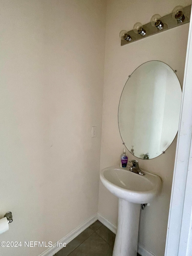 bathroom with tile patterned floors