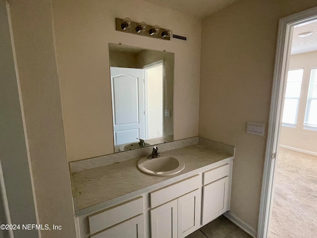 bathroom with vanity and tile patterned flooring