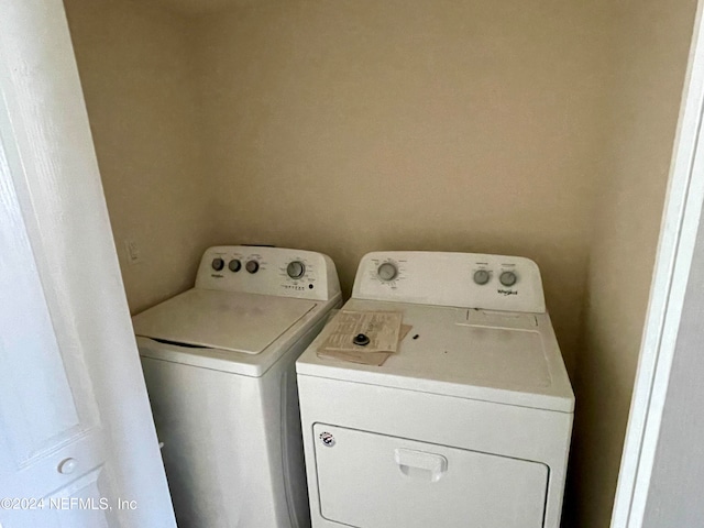 laundry area with separate washer and dryer