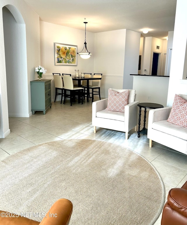 living room with tile patterned floors