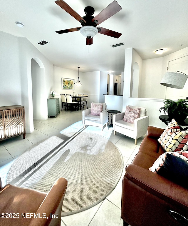 living room featuring ceiling fan and light tile patterned flooring