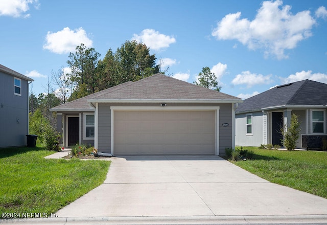 ranch-style home featuring a garage and a front yard