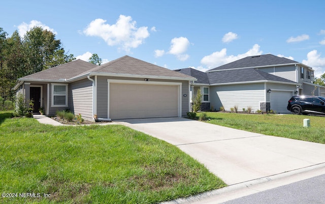 ranch-style home featuring a garage and a front lawn