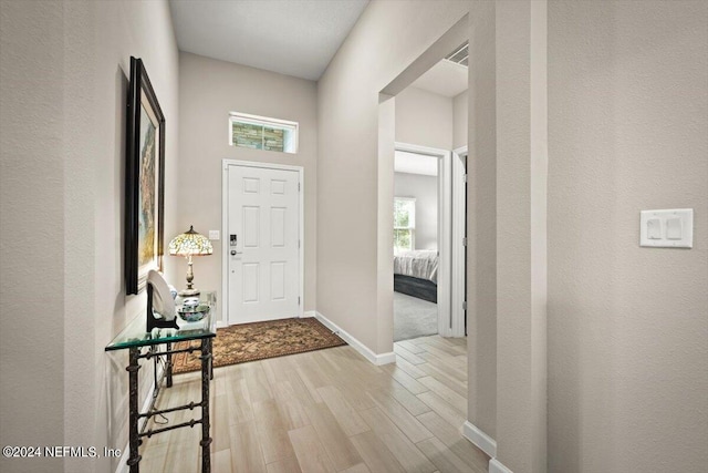 foyer with light wood-type flooring