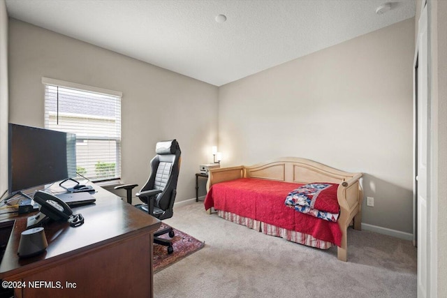 carpeted bedroom featuring vaulted ceiling and a textured ceiling