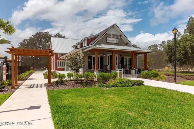 view of front facade featuring a front yard and a porch