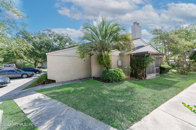 view of property exterior featuring a yard