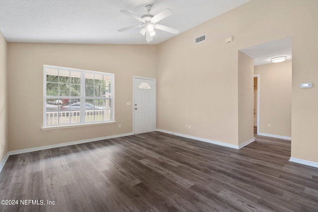 interior space featuring ceiling fan, dark hardwood / wood-style flooring, and vaulted ceiling