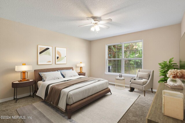 carpeted bedroom with a textured ceiling and ceiling fan