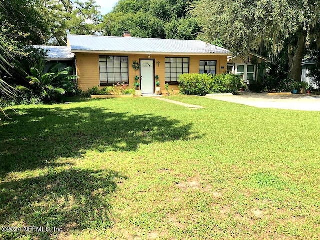 ranch-style house with a front lawn