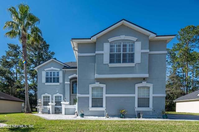 2518 Willow Creek Dr, Fleming Island, FL 32003 - view of front of property with stucco siding and a front yard