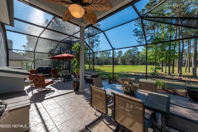 2518 Willow Creek Dr, Fleming Island, FL 32003 - view of patio featuring glass enclosure, ceiling fan, and outdoor dining space