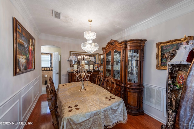 2518 Willow Creek Dr, Fleming Island, FL 32003 - dining room with visible vents, arched walkways, and wood finished floors