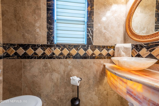 2518 Willow Creek Dr, Fleming Island, FL 32003 - half bathroom with a sink and tile walls