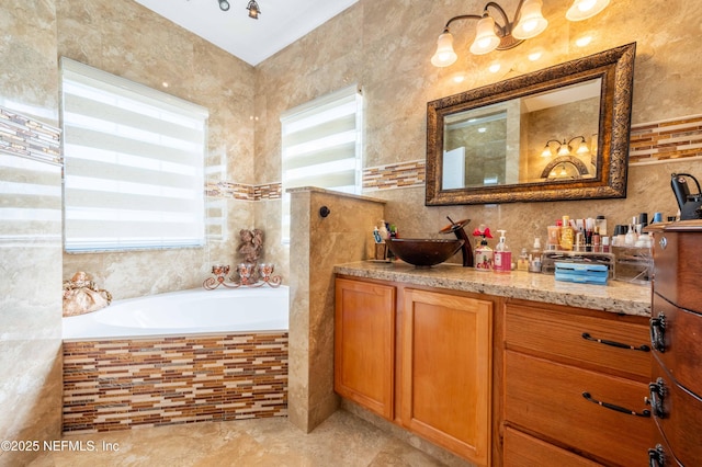 2518 Willow Creek Dr, Fleming Island, FL 32003 - bathroom with vanity, tile walls, a bath, and tile patterned flooring