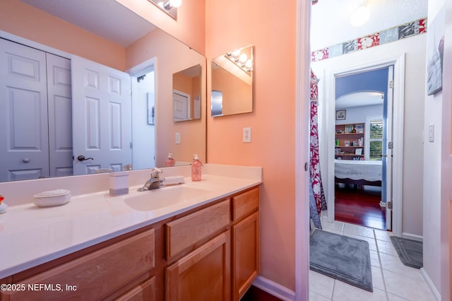 2518 Willow Creek Dr, Fleming Island, FL 32003 - ensuite bathroom featuring vanity, tile patterned floors, baseboards, and ensuite bathroom
