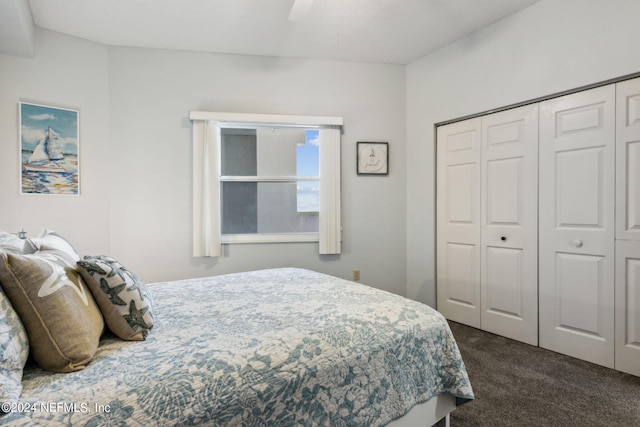 bedroom featuring a closet, ceiling fan, and dark colored carpet