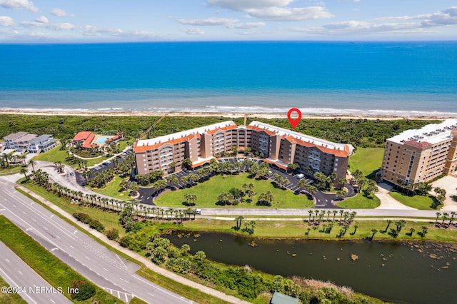 aerial view with a beach view and a water view