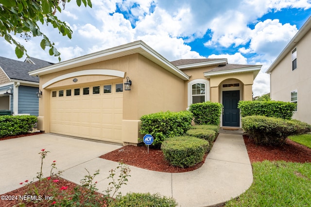 view of front of property featuring a garage