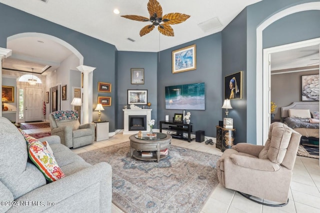 tiled living room featuring ceiling fan