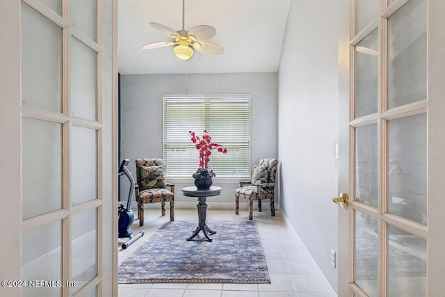 home office with ceiling fan and light tile patterned floors