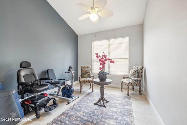 workout area with tile patterned flooring, vaulted ceiling, baseboards, and ceiling fan