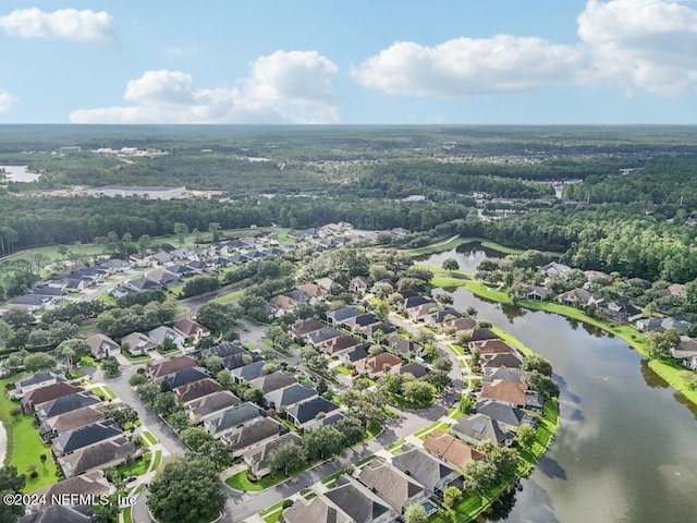 birds eye view of property with a water view and a residential view