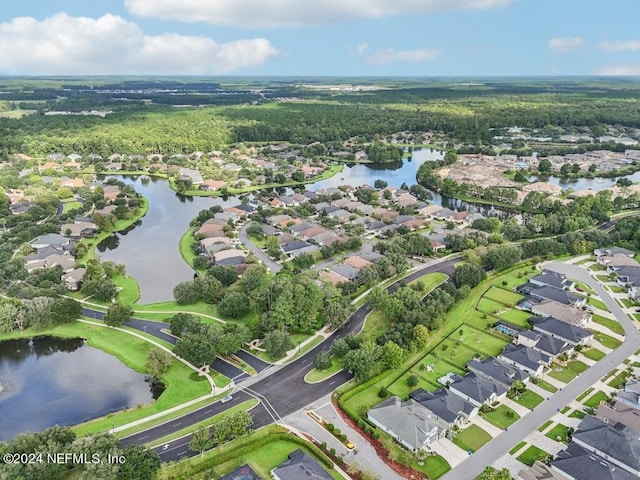 bird's eye view with a residential view and a water view